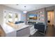 Modern living room with a large sectional sofa and built-in entertainment center at 8324 Ludington Cir, Orlando, FL 32836