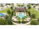 Community pool with lounge chairs and a covered pavilion at 8324 Ludington Cir, Orlando, FL 32836