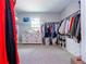 Large walk-in closet with ample shelving and hanging space at 8324 Ludington Cir, Orlando, FL 32836