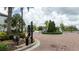 Gated community entrance with security access and landscaping at 8324 Ludington Cir, Orlando, FL 32836