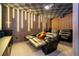 Home theater with black reclining seats and large screen at 8324 Ludington Cir, Orlando, FL 32836