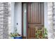 Close-up view of the home's dark brown front door at 8324 Ludington Cir, Orlando, FL 32836
