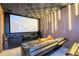 Home theater with black reclining seats and large screen at 8324 Ludington Cir, Orlando, FL 32836