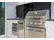 Stainless steel outdoor kitchen with grill and built-in drawers at 8324 Ludington Cir, Orlando, FL 32836