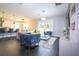 Spacious living room with modern furniture and backyard access at 8324 Ludington Cir, Orlando, FL 32836