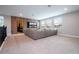 Spacious home theater with large sectional sofa and projection screen at 8324 Ludington Cir, Orlando, FL 32836