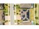 Aerial view of house featuring solar panels and a backyard at 8324 Ludington Cir, Orlando, FL 32836