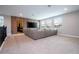 Spacious home theater with large sectional sofa and projection screen at 8324 Ludington Cir, Orlando, FL 32836