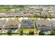 Aerial view of neighborhood with several homes and solar panels at 8324 Ludington Cir, Orlando, FL 32836