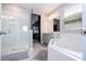 Elegant bathroom with a walk-in shower and a corner soaking tub at 8324 Ludington Cir, Orlando, FL 32836
