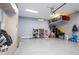 Garage with overhead storage, shelving and extra cabinets at 8324 Ludington Cir, Orlando, FL 32836