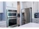 Modern kitchen featuring stainless steel appliances and ample cabinetry at 8324 Ludington Cir, Orlando, FL 32836