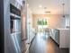 Modern kitchen with stainless steel appliances and breakfast bar at 8324 Ludington Cir, Orlando, FL 32836