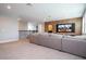 Spacious home theater with large sectional sofa and projection screen at 8324 Ludington Cir, Orlando, FL 32836