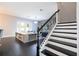 Modern staircase with black metal railing at 8324 Ludington Cir, Orlando, FL 32836