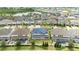 Aerial view of house with solar panels, pool, and fenced backyard at 8324 Ludington Cir, Orlando, FL 32836