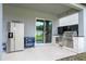 Outdoor kitchen with stainless steel grill and refrigerator at 8324 Ludington Cir, Orlando, FL 32836