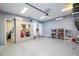 Garage with overhead storage, shelving and extra cabinets at 8324 Ludington Cir, Orlando, FL 32836