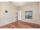 Bedroom with wood flooring and view of patio at 1611 Sand Key Cir, Oviedo, FL 32765