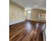Bright and airy living room showcasing wood-look flooring throughout at 1611 Sand Key Cir, Oviedo, FL 32765