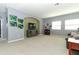 Bright bonus room featuring a TV, furniture, and neutral walls at 319 Morning View Dr, Winter Garden, FL 34787