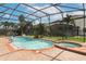 Irregular shaped pool with a spa and water features at 319 Morning View Dr, Winter Garden, FL 34787