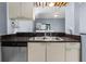Kitchen features double sink, dishwasher and granite countertops at 101 N Hill Ave # 4, Deland, FL 32724