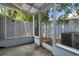 Screened porch overlooks a fenced-in backyard at 101 N Hill Ave # 4, Deland, FL 32724