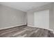 Spacious bedroom with wood-look floors and a large closet at 1402 Persimmon Ave, Sanford, FL 32771