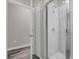 Bathroom with a walk-in shower and marble tile at 1402 Persimmon Ave, Sanford, FL 32771