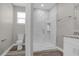 Bathroom with a walk-in shower and marble tile at 1402 Persimmon Ave, Sanford, FL 32771