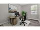 Home office with desk, chair, and window at 1402 Persimmon Ave, Sanford, FL 32771