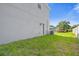 Side yard with grass and a view of a boat at 1402 Persimmon Ave, Sanford, FL 32771