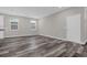 Open living area with hardwood floors and neutral wall colors at 1402 Persimmon Ave, Sanford, FL 32771