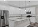 Modern kitchen with stainless steel appliances and granite countertops at 1402 Persimmon Ave, Sanford, FL 32771