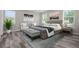 Main bedroom with wood-look flooring and large windows at 1402 Persimmon Ave, Sanford, FL 32771