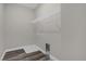 Laundry room with built-in shelving and drain at 1402 Persimmon Ave, Sanford, FL 32771