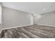Open living area with gray walls and hardwood floors at 1402 Persimmon Ave, Sanford, FL 32771