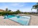 Large rectangular pool with a spa and a basketball hoop at 415 Muirfield Loop, Reunion, FL 34747