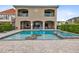 Two-story house with pool and patio, perfect for entertaining at 415 Muirfield Loop, Reunion, FL 34747