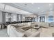 Formal dining room with large table and chairs, and a view of the kitchen at 415 Muirfield Loop, Reunion, FL 34747