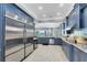 Modern kitchen with stainless steel appliances and granite countertops at 415 Muirfield Loop, Reunion, FL 34747
