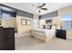 Bright bedroom with a king-size bed and plenty of natural light at 415 Muirfield Loop, Reunion, FL 34747