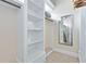 Large walk-in closet with built-in shelving and hanging space at 415 Muirfield Loop, Reunion, FL 34747