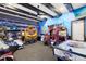 Fun game room with various arcade games and air hockey at 415 Muirfield Loop, Reunion, FL 34747