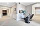 Spacious game room with two gaming chairs and large screens at 415 Muirfield Loop, Reunion, FL 34747