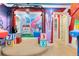 Playroom with music-themed murals, and a stage at 415 Muirfield Loop, Reunion, FL 34747