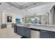 Open kitchen with granite counters and stainless steel appliances at 415 Muirfield Loop, Reunion, FL 34747