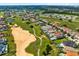 Community overview showing upscale homes and golf course at 415 Muirfield Loop, Reunion, FL 34747