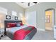 Spacious bedroom with king-size bed and red accents at 415 Muirfield Loop, Reunion, FL 34747